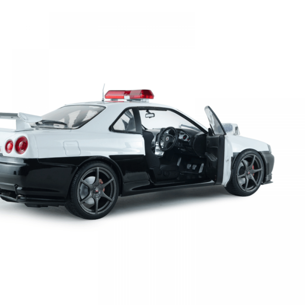 Macheta auto Nissan Skyline GT-R (BNR34) Japanese Police White 1999 1:18 Solido Precomanda