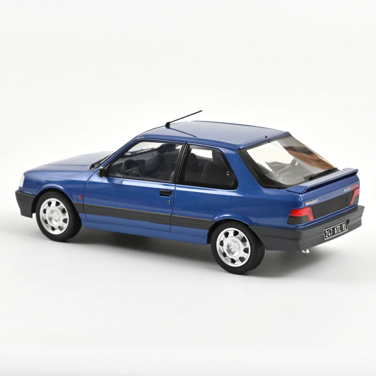 Macheta auto Peugeot 309 GTi16 1991 albastru metalic scara 1:18 Norev